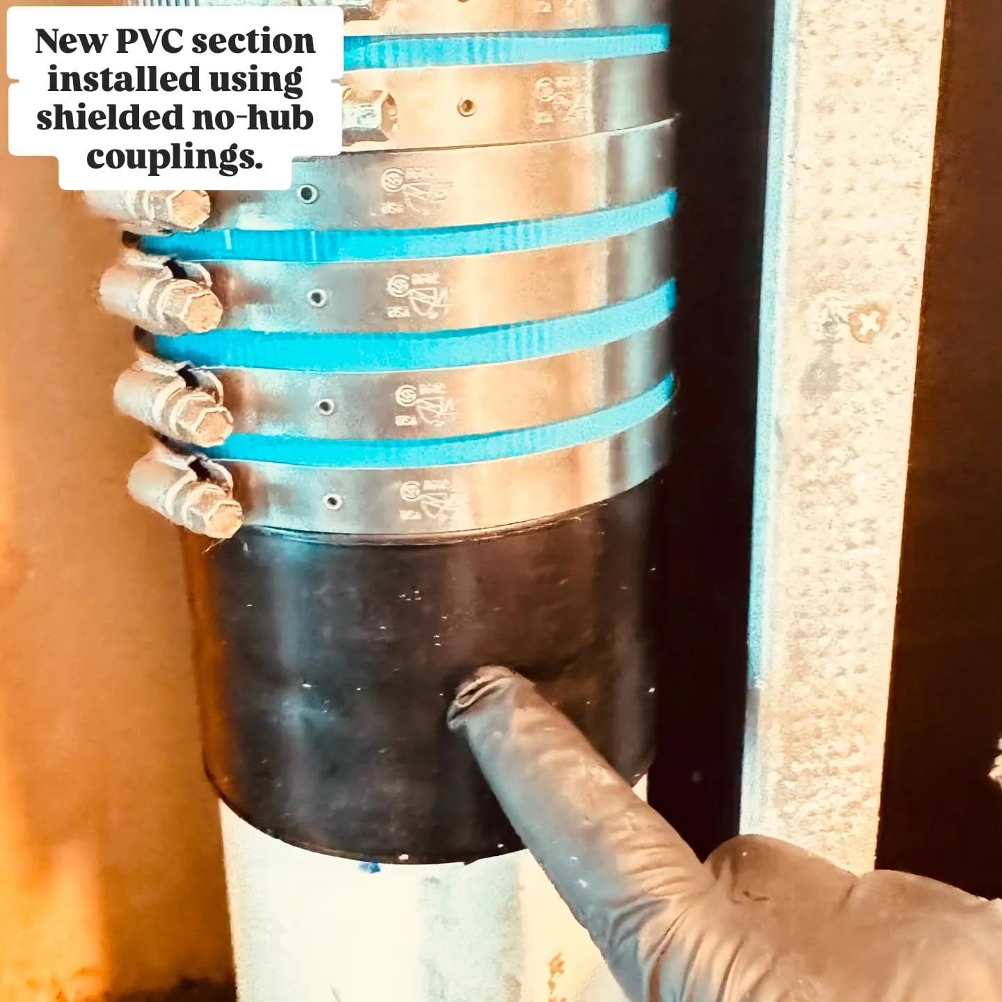 New section of PVC stack joined with stainless shielded no-hub couplings