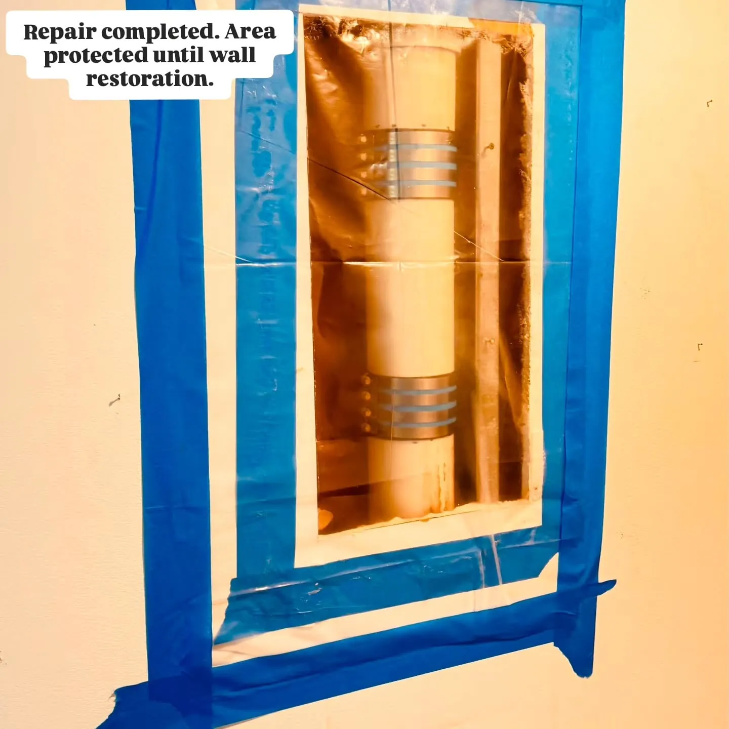 Repaired stack opening covered with plastic and taped off until the wall is restored